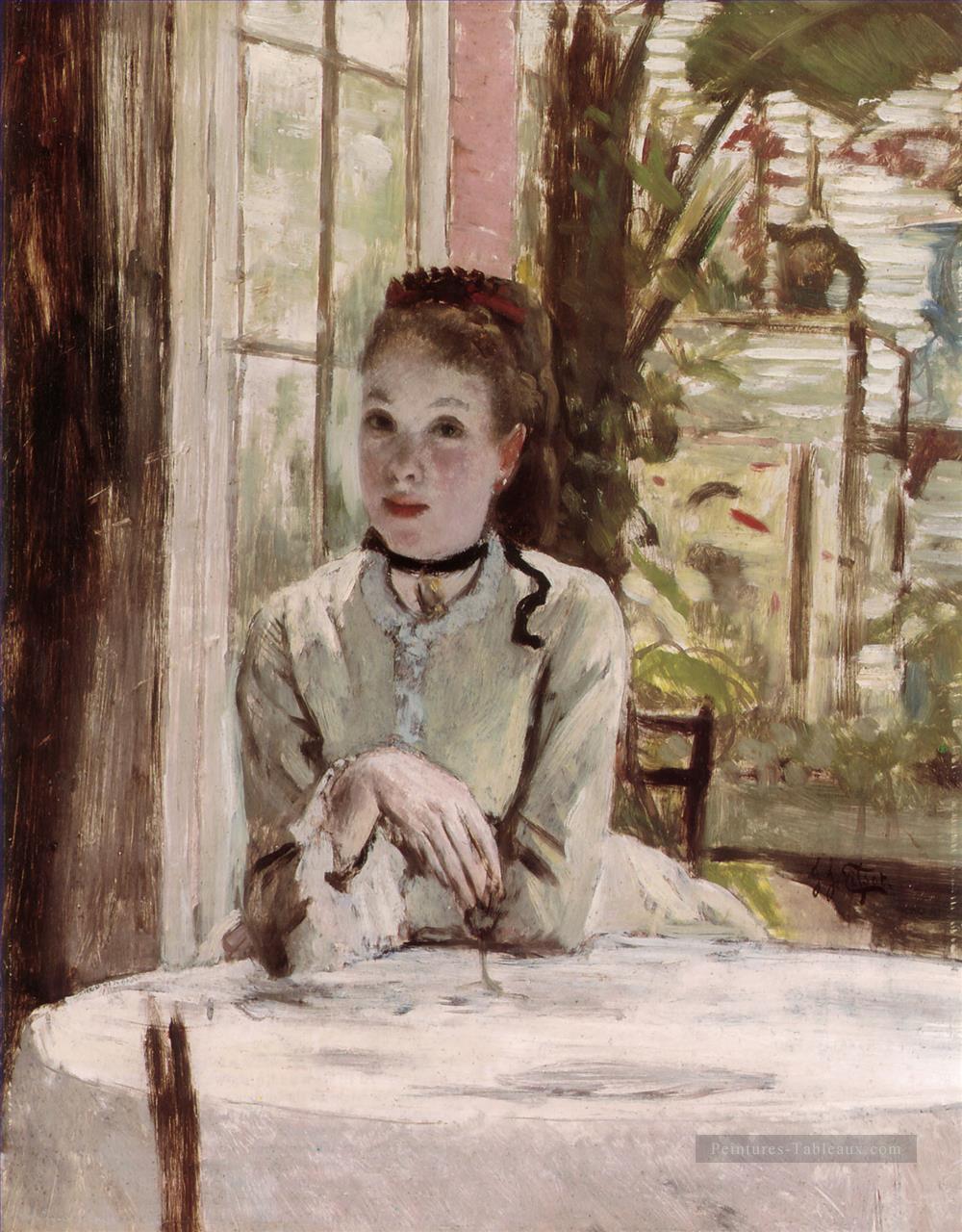 Une femme dans un intérieur élégant James Jacques Joseph Tissot Peintures à l'huile